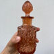 Art Deco perfume bottle in old amber pink glass