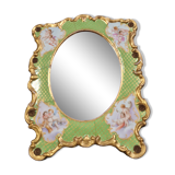 Porcelain mirror with cherub decorations circa 1900