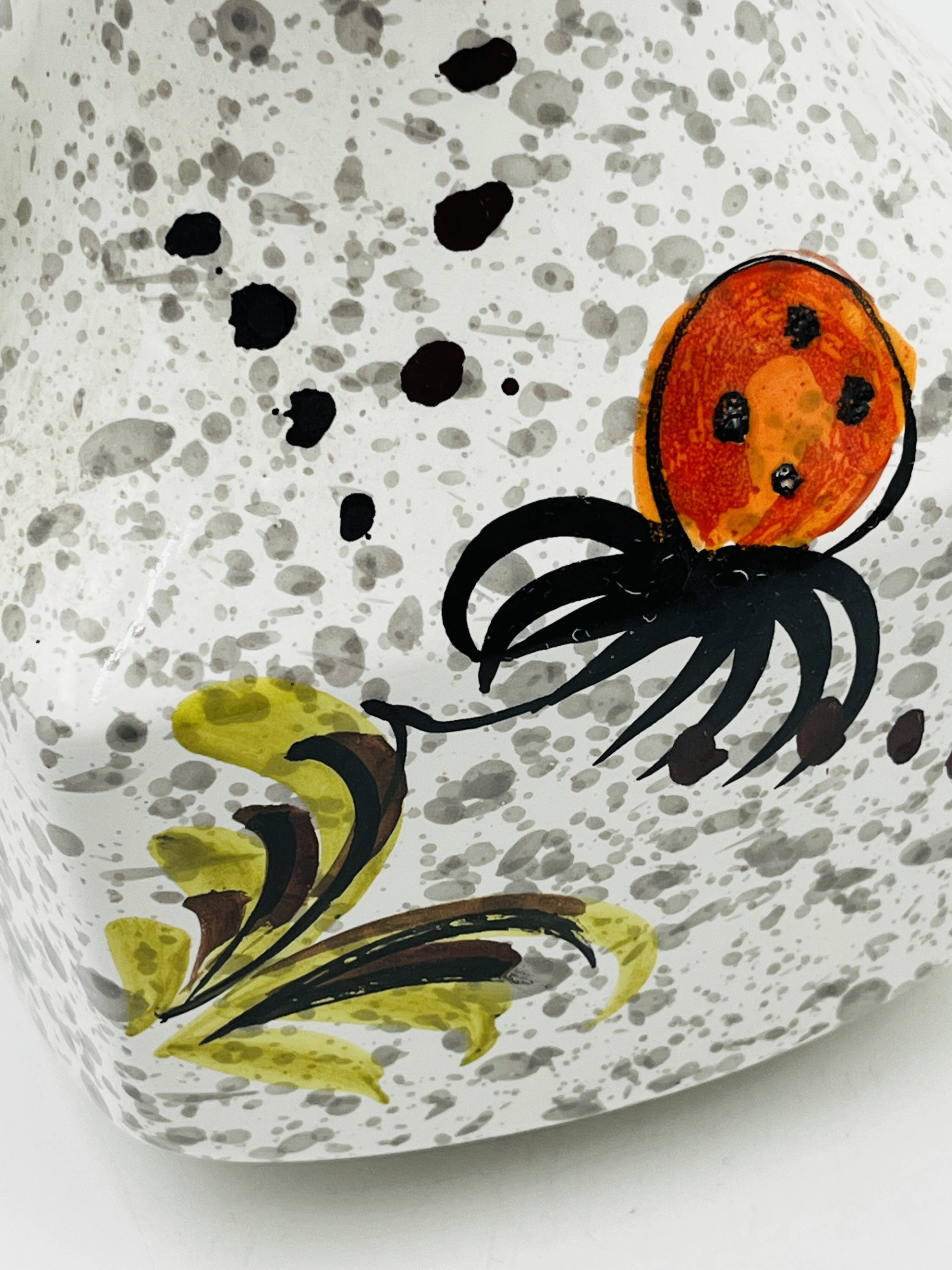 Vintage Italian vase in the shape of a carafe with floral decoration from the 1970s.