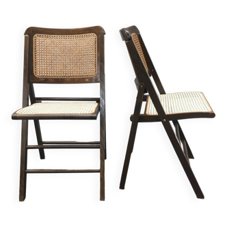 Série de deux chaises pliantes vintage en bois et cannage