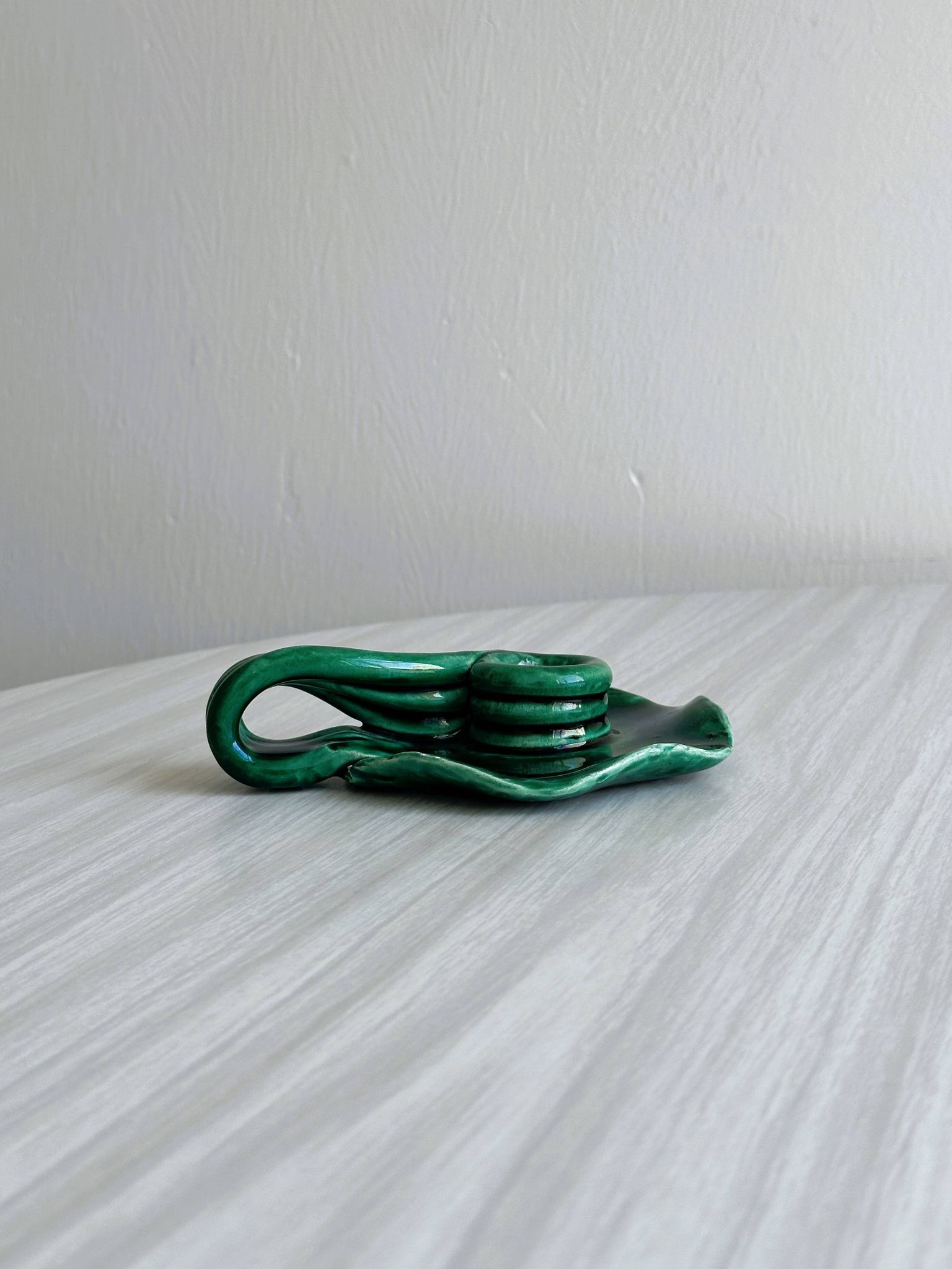 Vintage green glazed ceramic candle holder, organic design.