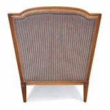 Armchair in the style of Louis XVI made of solid wood, striped fabric.