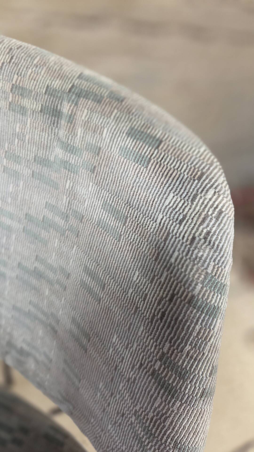 Vintage armchair from the 60s/70s in wood and grey fabric – with armrests.