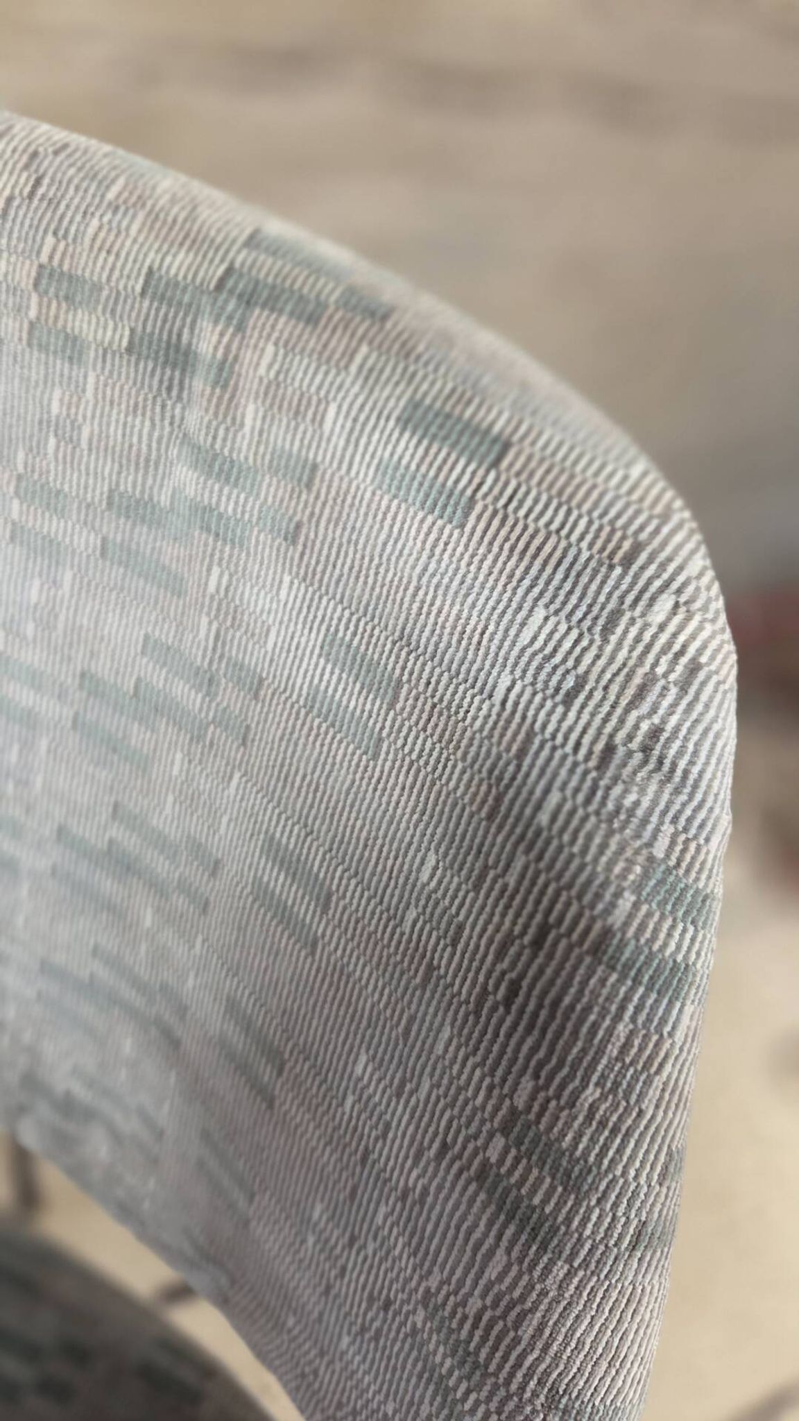 Vintage armchair from the 60s/70s in wood and grey fabric – with armrests.