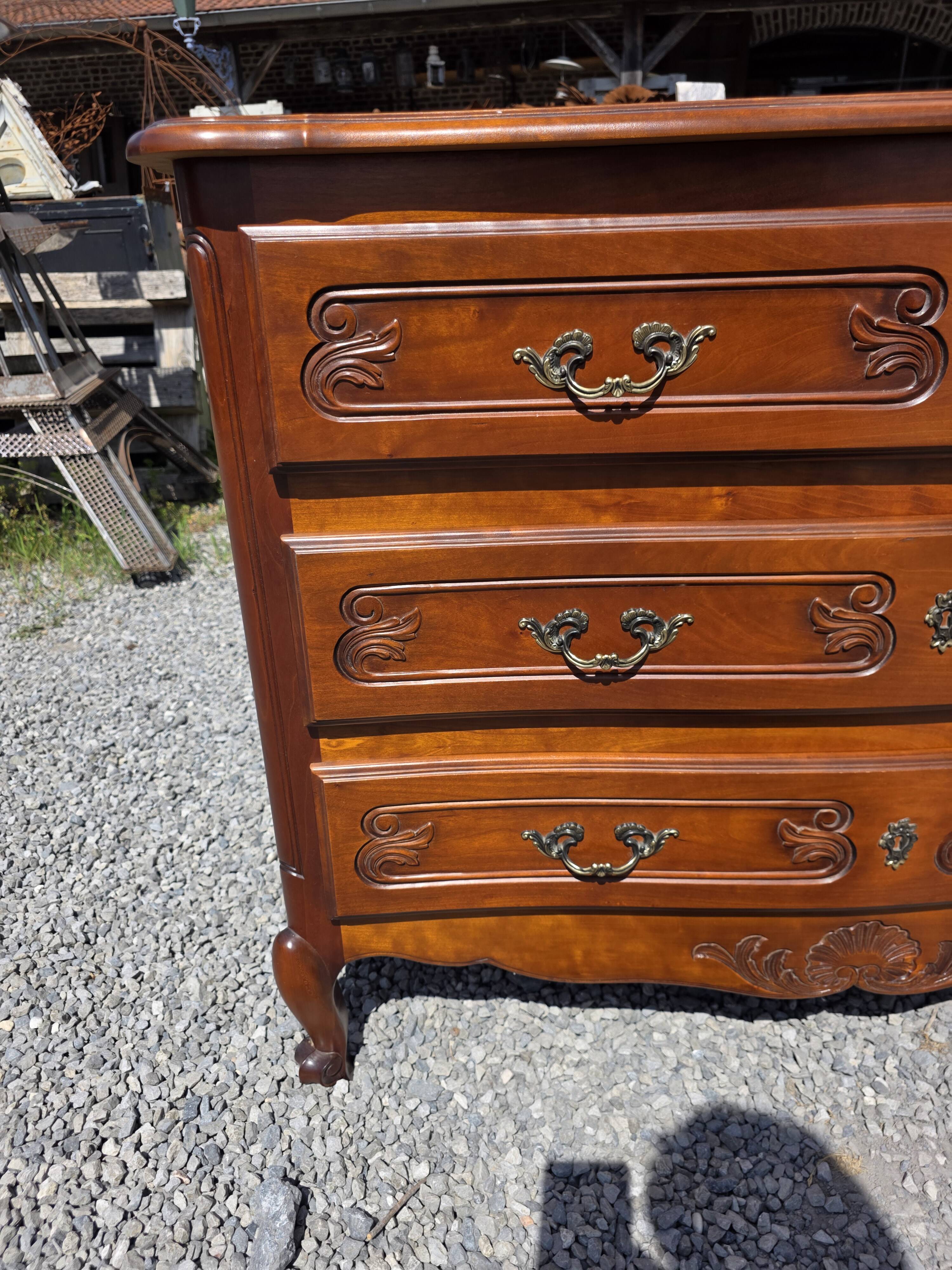 Curved commode in Louis XV style made of cherry wood.