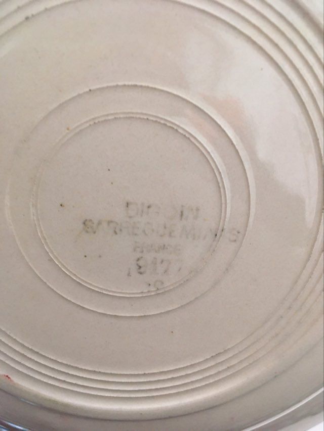 Matching old hollow plates in pink and green.