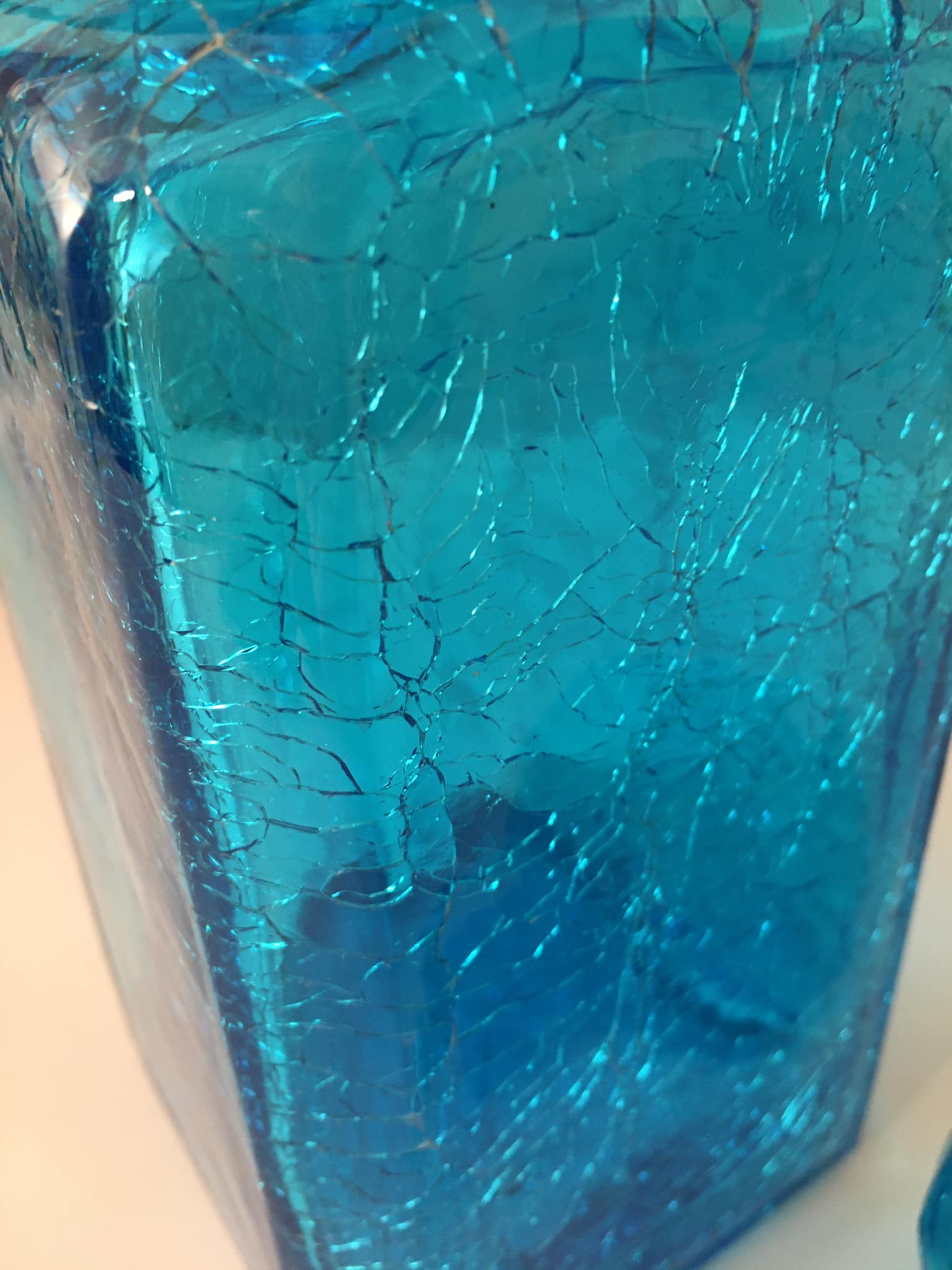 Blue glass bottle with glass cap