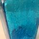 Blue glass bottle with glass cap