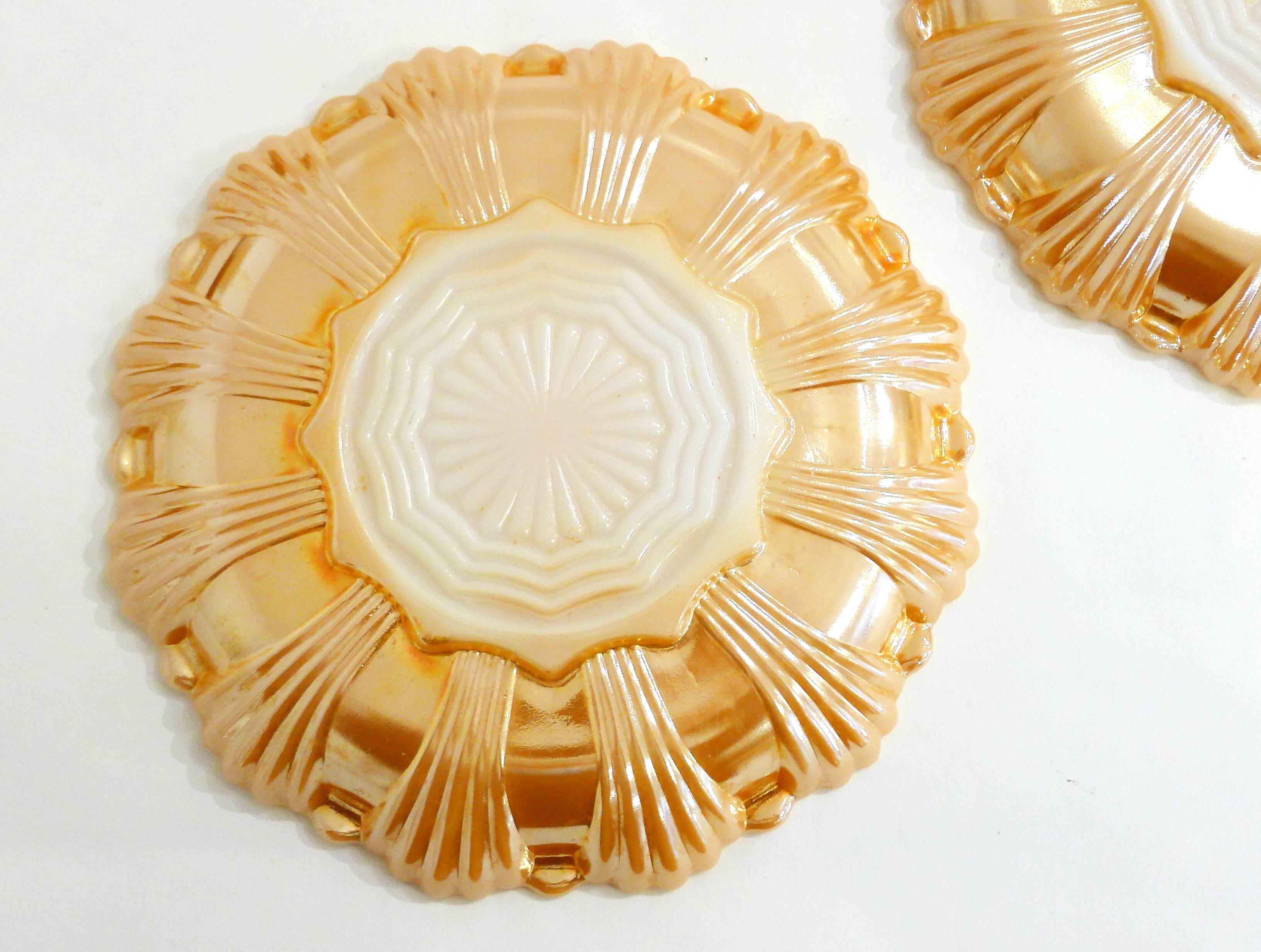 Pair of iridescent orange glass egg plates
