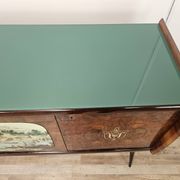 1950s mahogany sideboard with a glass top and central bar.
