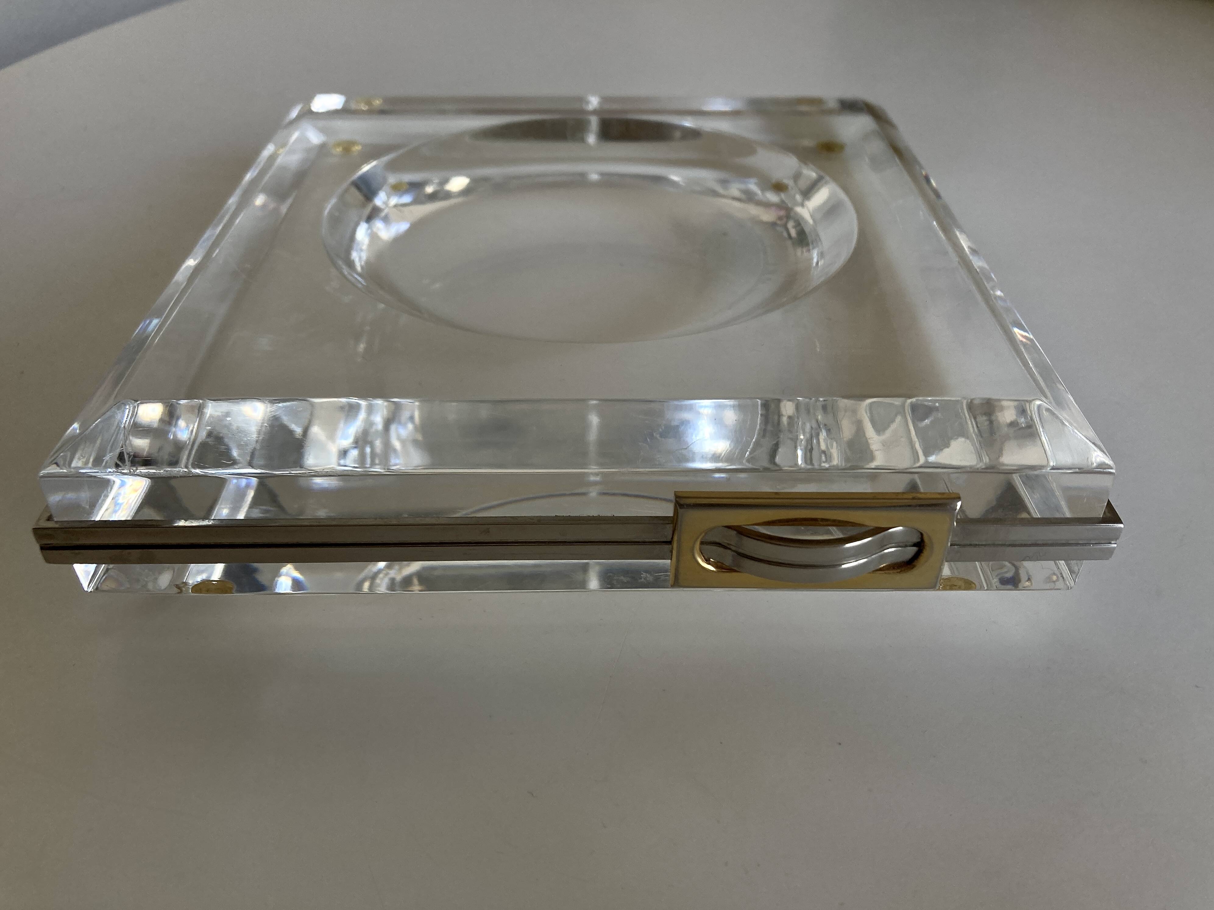 Plexiglas pocket emptier with brass and nickel silver surround, 1975, in the style of Pergay