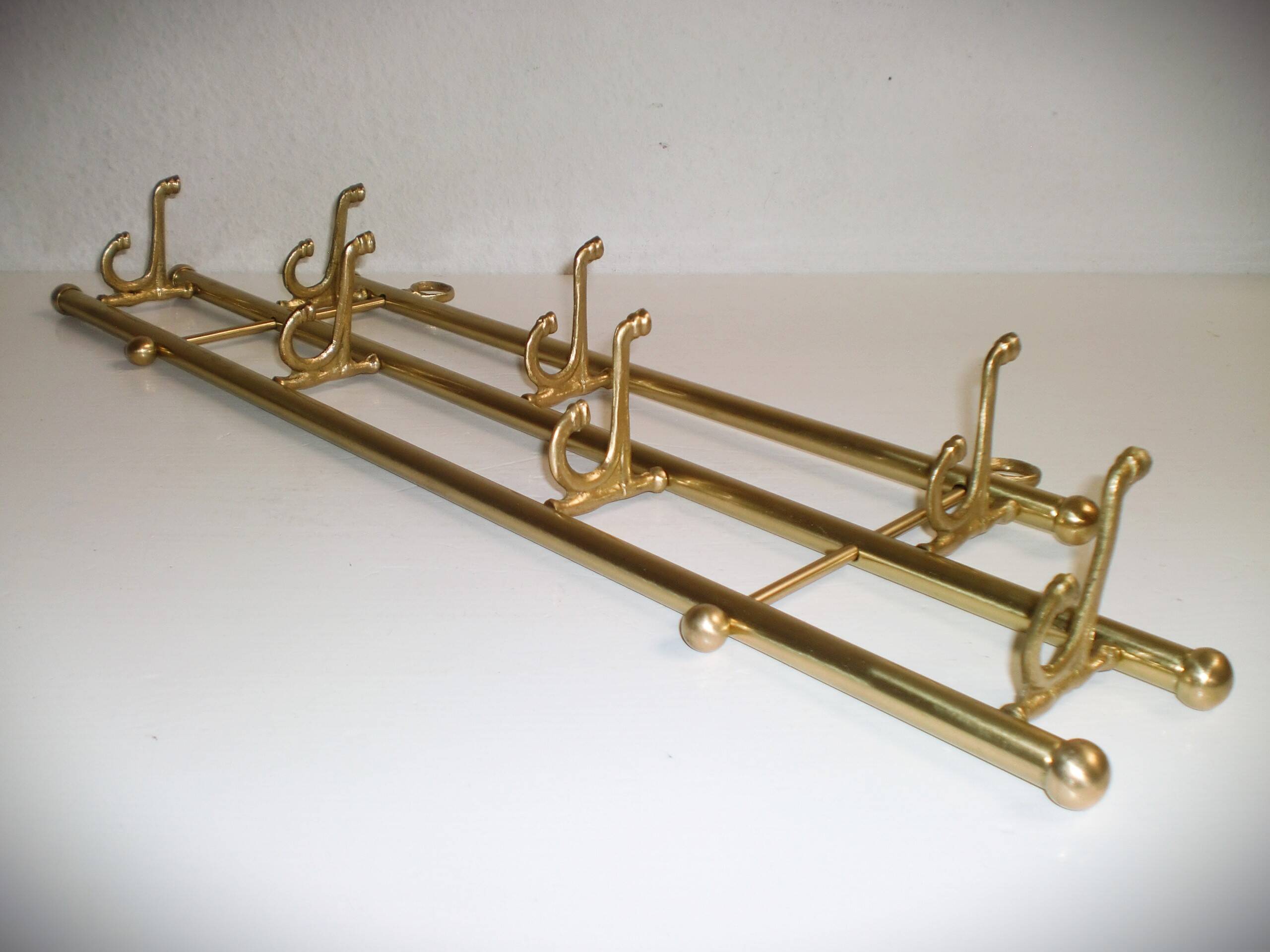 1 of 2 brass coat racks with 7 foldable hooks 1940s art-deco