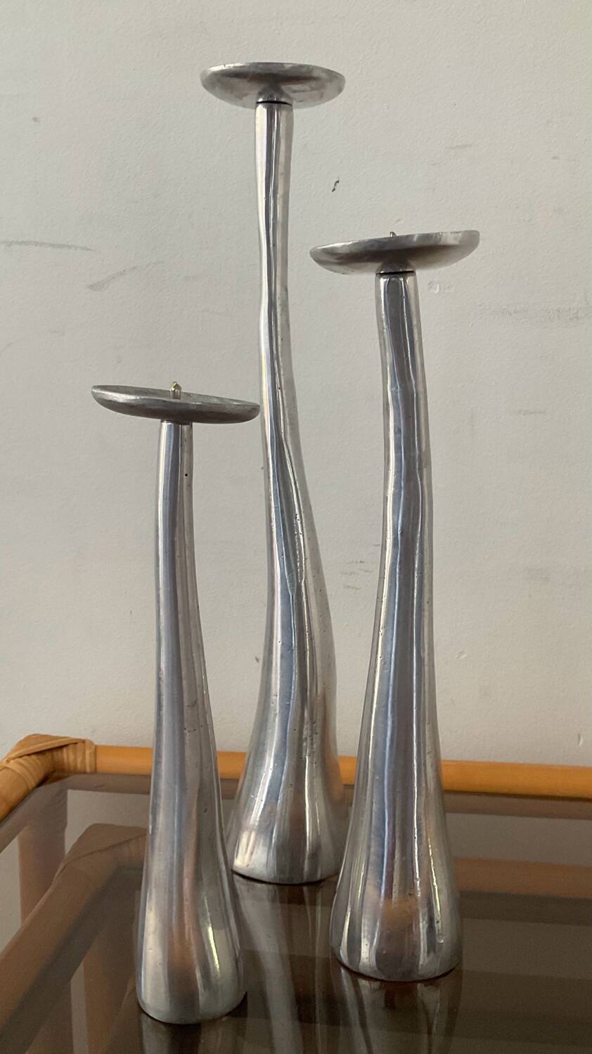 Trio of vintage cast aluminum candlesticks
