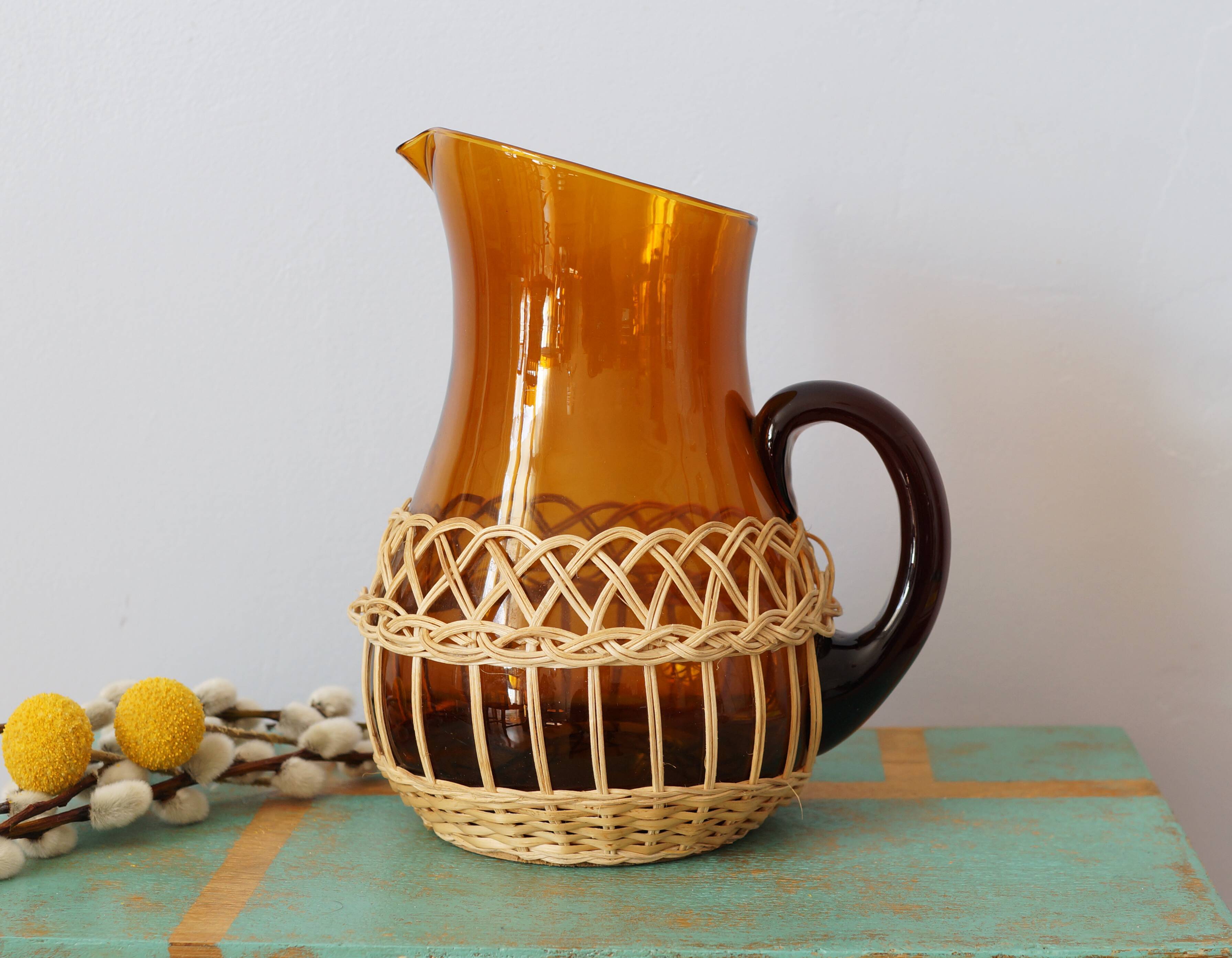 Amber glass decanter dressed in wicker, vintage