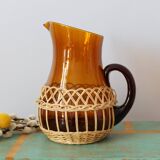 Amber glass decanter dressed in wicker, vintage