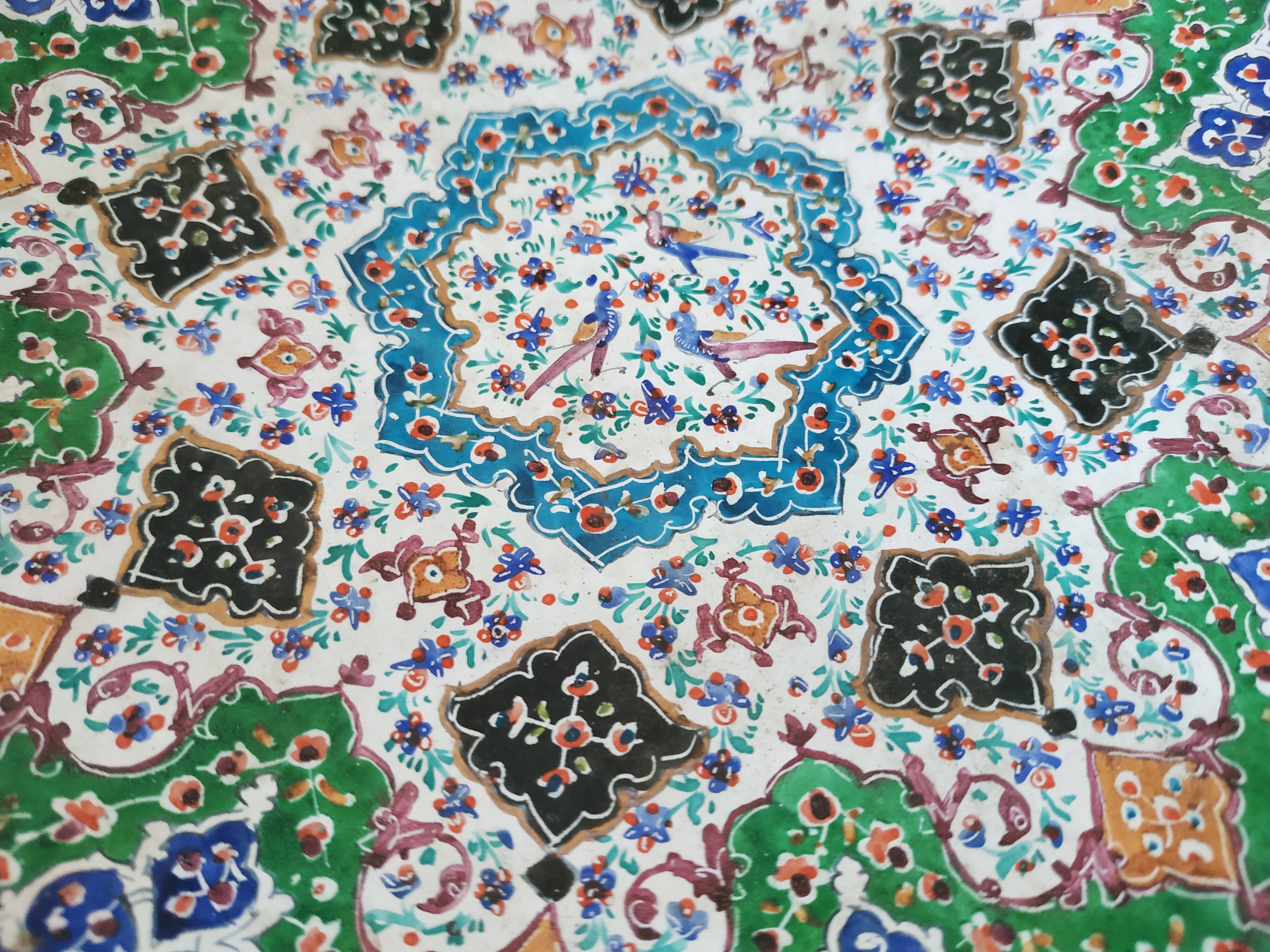 Plate and two decorative saucers enamelled with Persia decoration, circa 1940