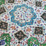 Plate and two decorative saucers enamelled with Persia decoration, circa 1940