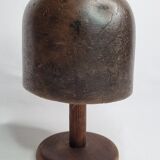 Old solid wood hat shape on foot, 1900