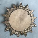Sun mirror decorated with golden leaves, circa 1950.