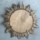 Sun mirror decorated with golden leaves, circa 1950.