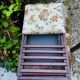 Folding footrest with vintage embroidery