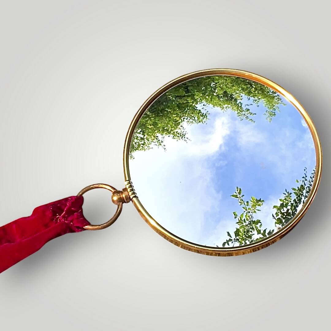 Antique convex "witch's eye" mirror