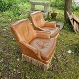 Paire fauteuils en cuir
