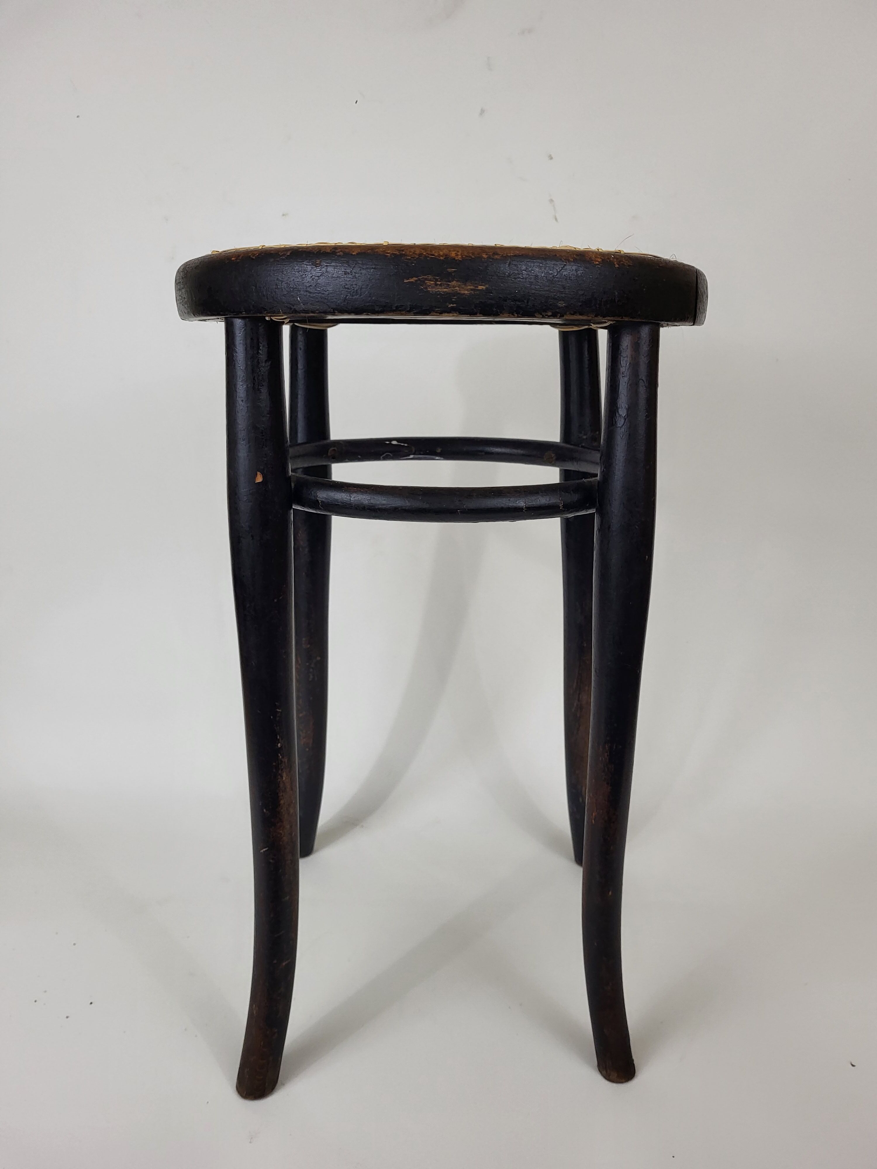 Blackened curved wooden stool Thonet