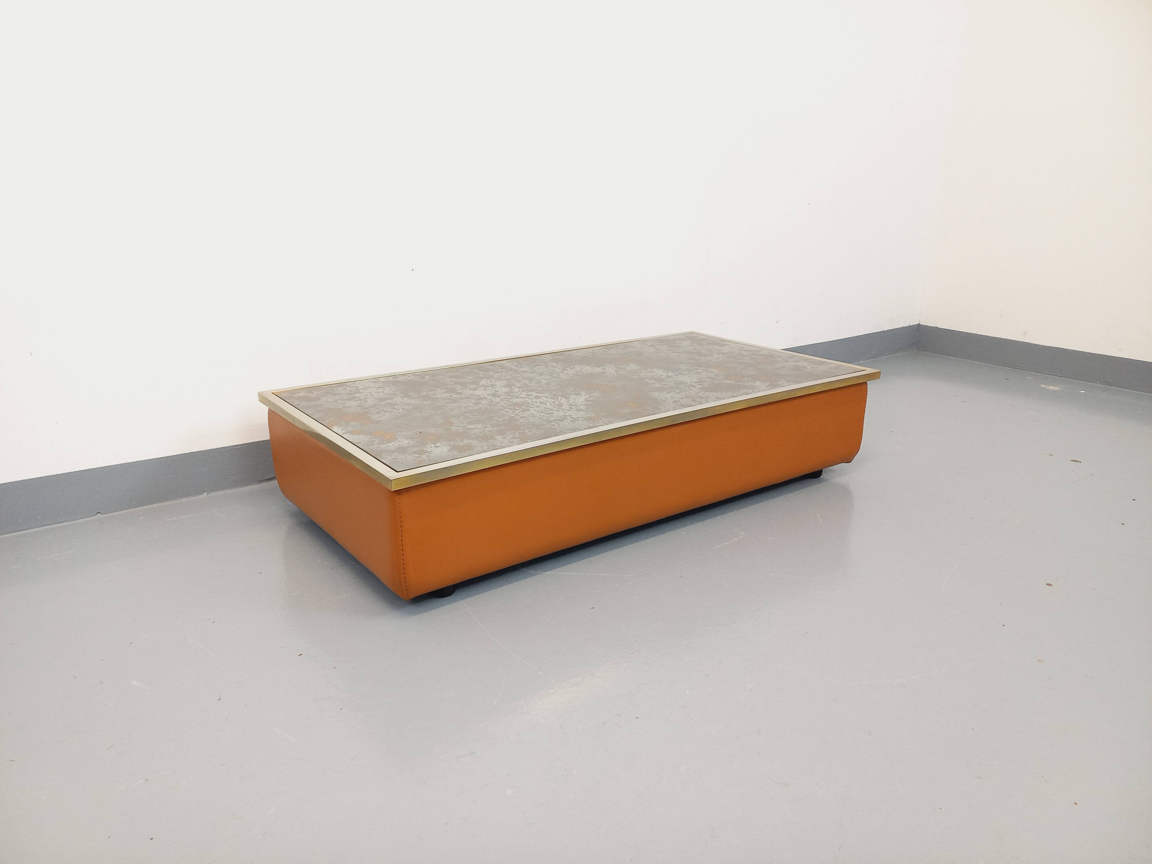 Vintage coffee table in églomisé glass, chrome and leather from the 70s