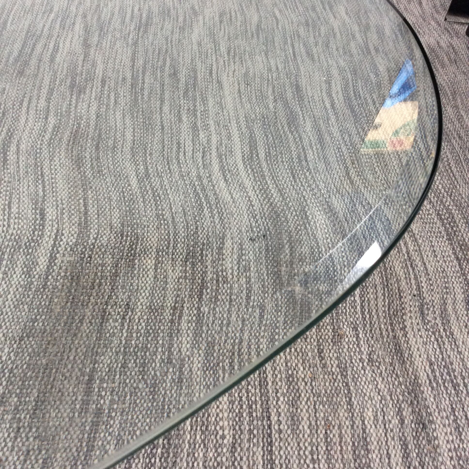 Design coffee table in beveled glass and steel foot