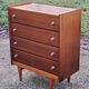 Vintage golden oak chest of drawers with 4 spindle feet from the 1950s
