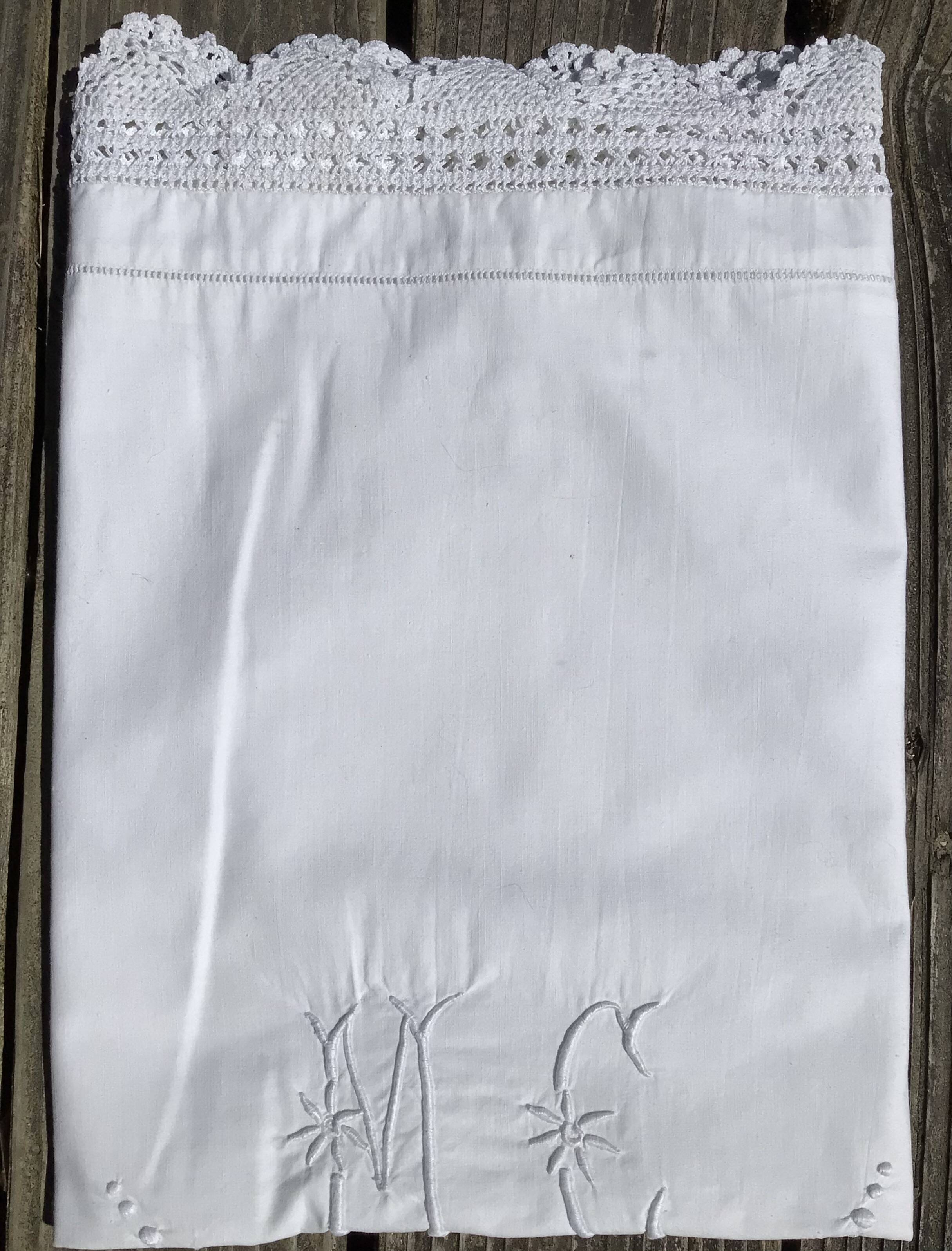 MC embroidered pillowcase with flower detailing and crocheted edge