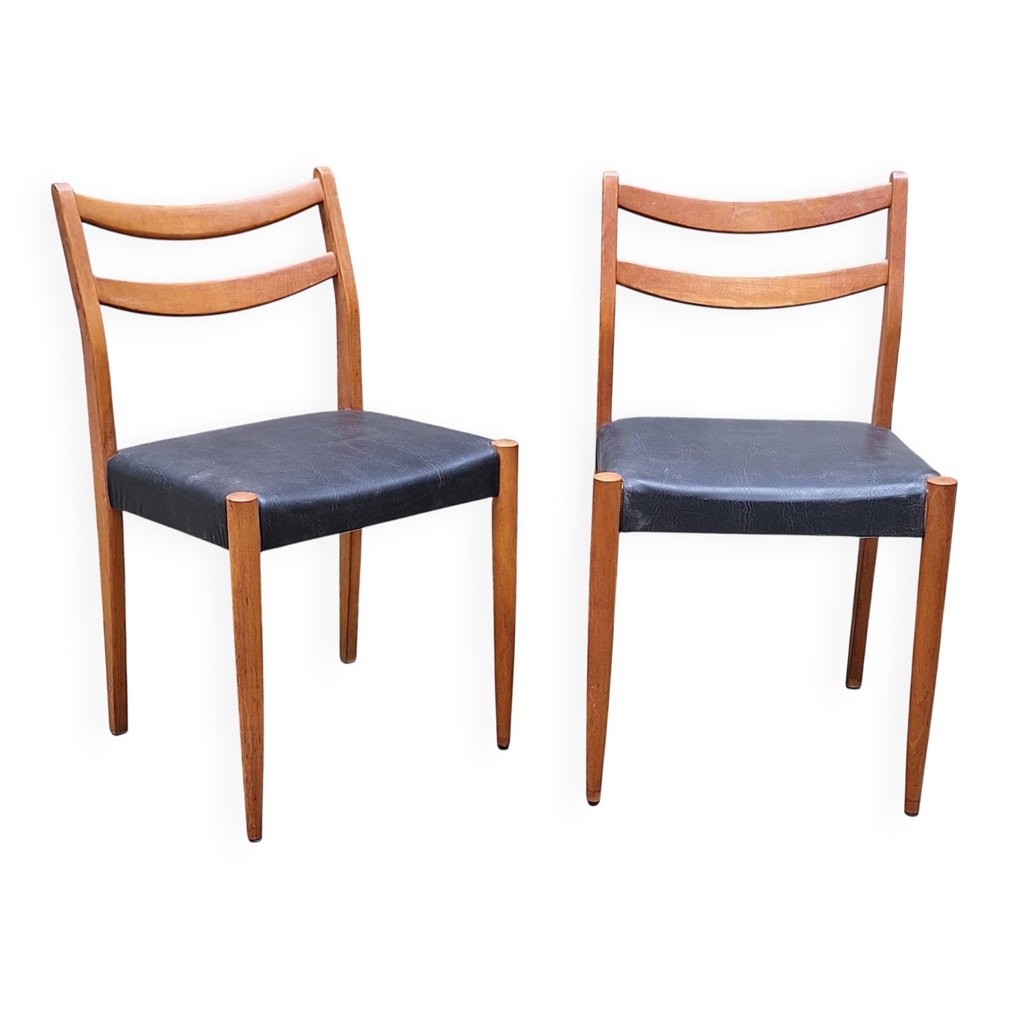 Pair of Scandinavian style chairs in wood and faux leather.