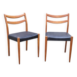 Pair of Scandinavian style chairs in wood and faux leather.