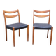Pair of Scandinavian style chairs in wood and faux leather.