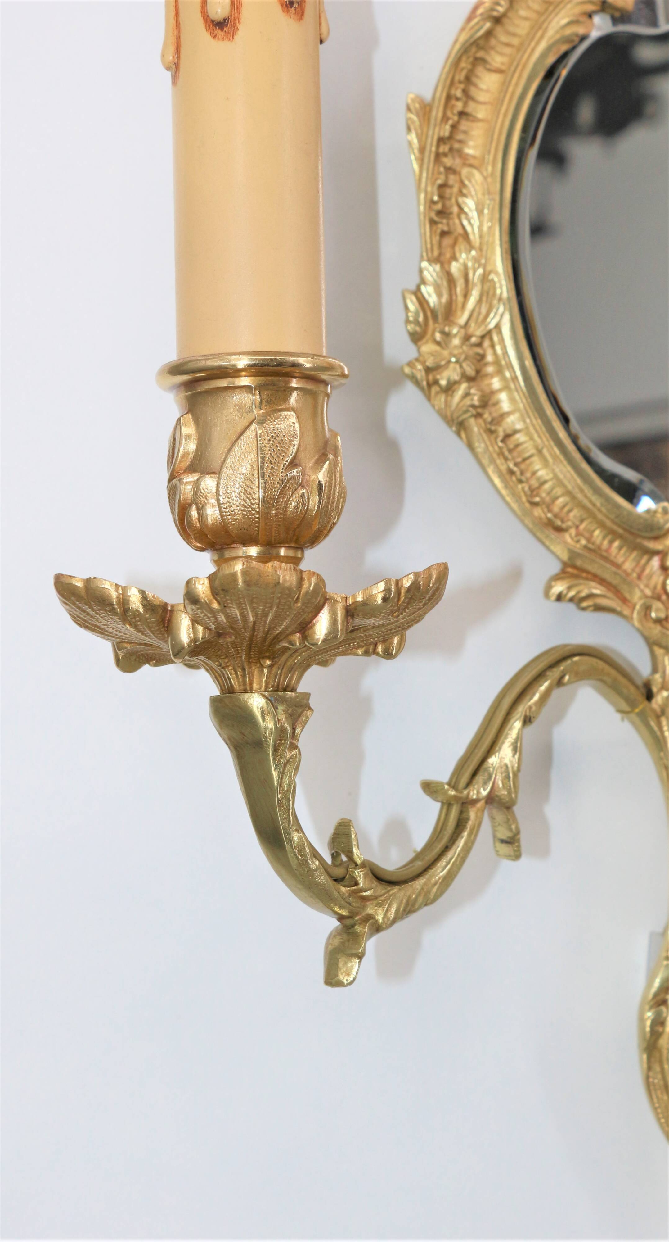 Pair of Louis XV style beveled mirror sconces in bronze by Lucien Gau
