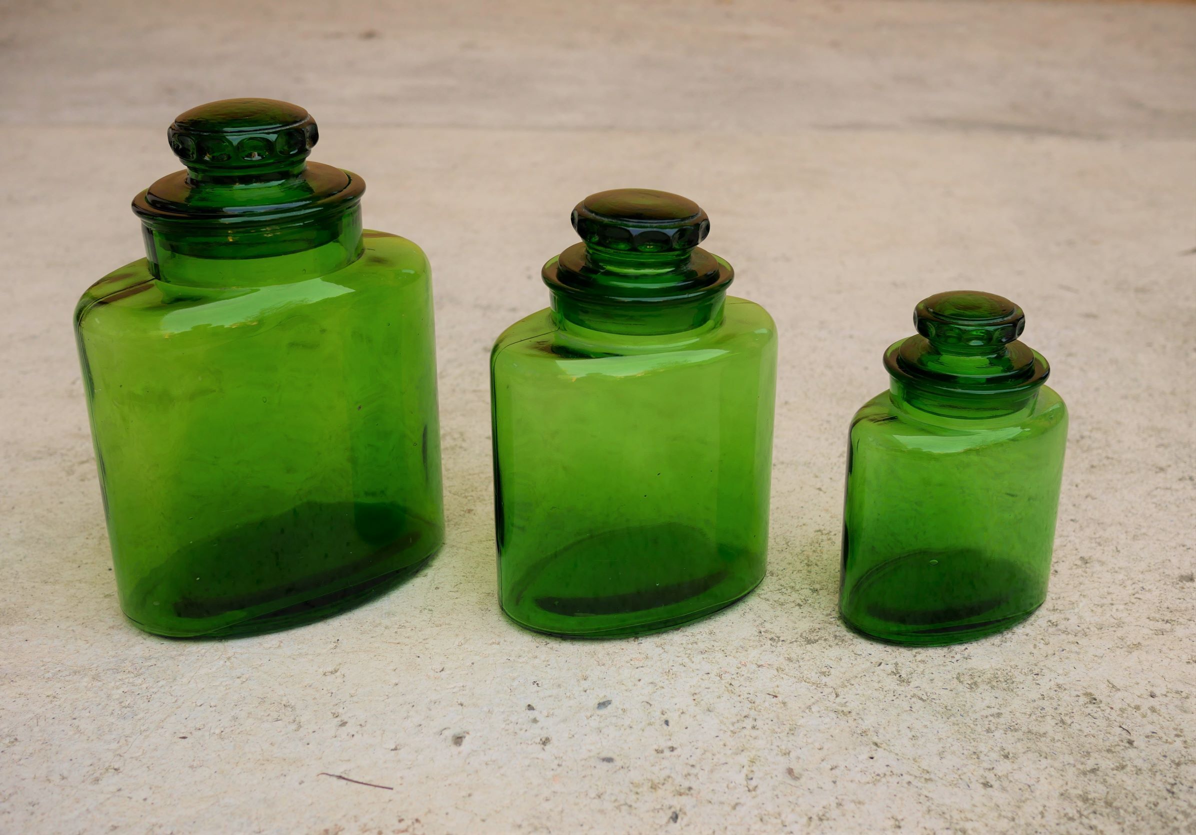 Series of 3 vintage glass jars