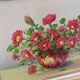 Painting red wild flowers in a vase.