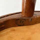 2 antique bistro stools with curved wood and caning effect.