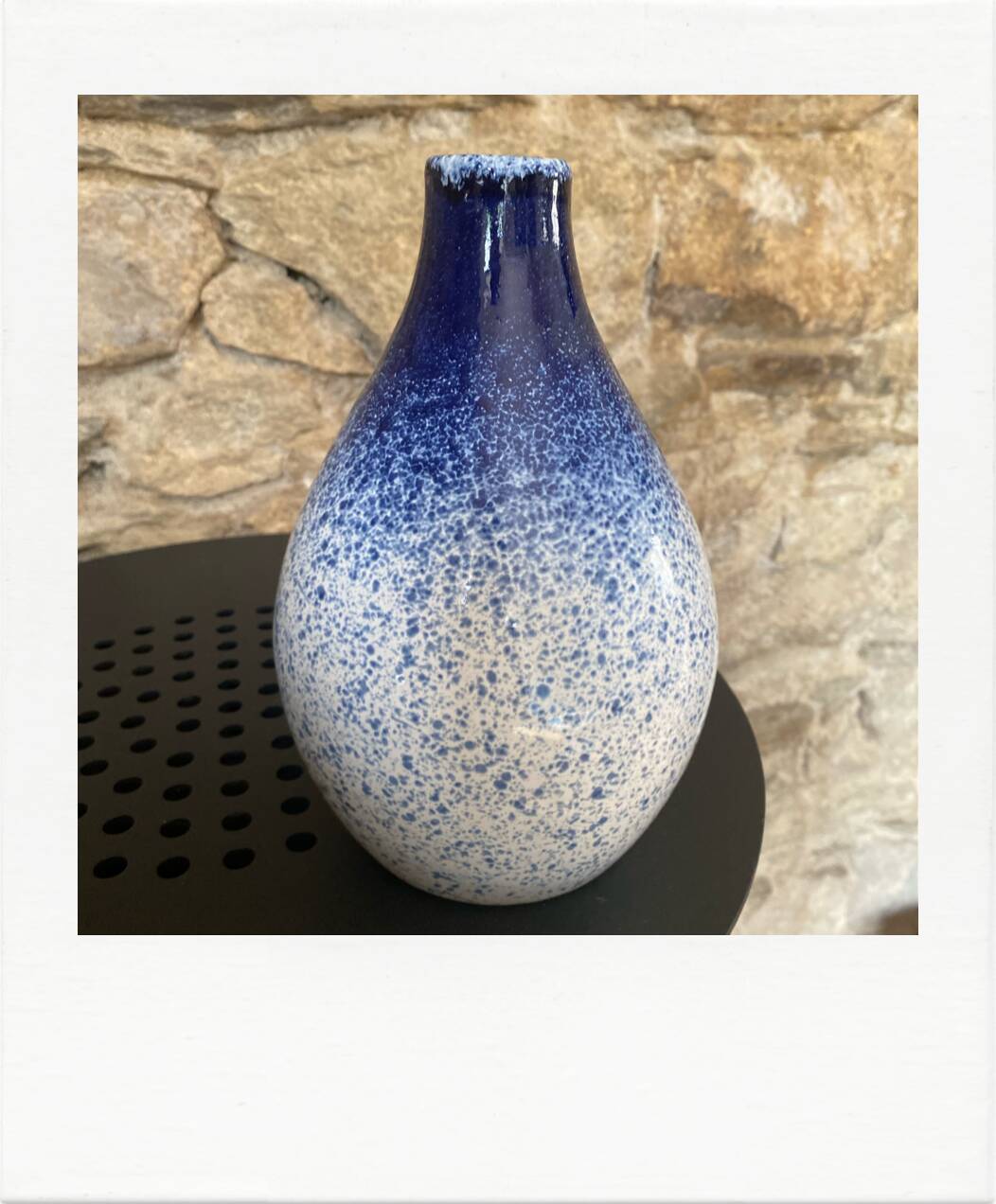 Blue and white speckled vase