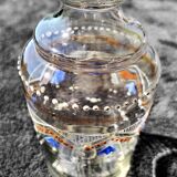 Enamelled decanter with its cap