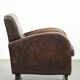 Comfortable sheepskin armchair with matching piping and a timeless look