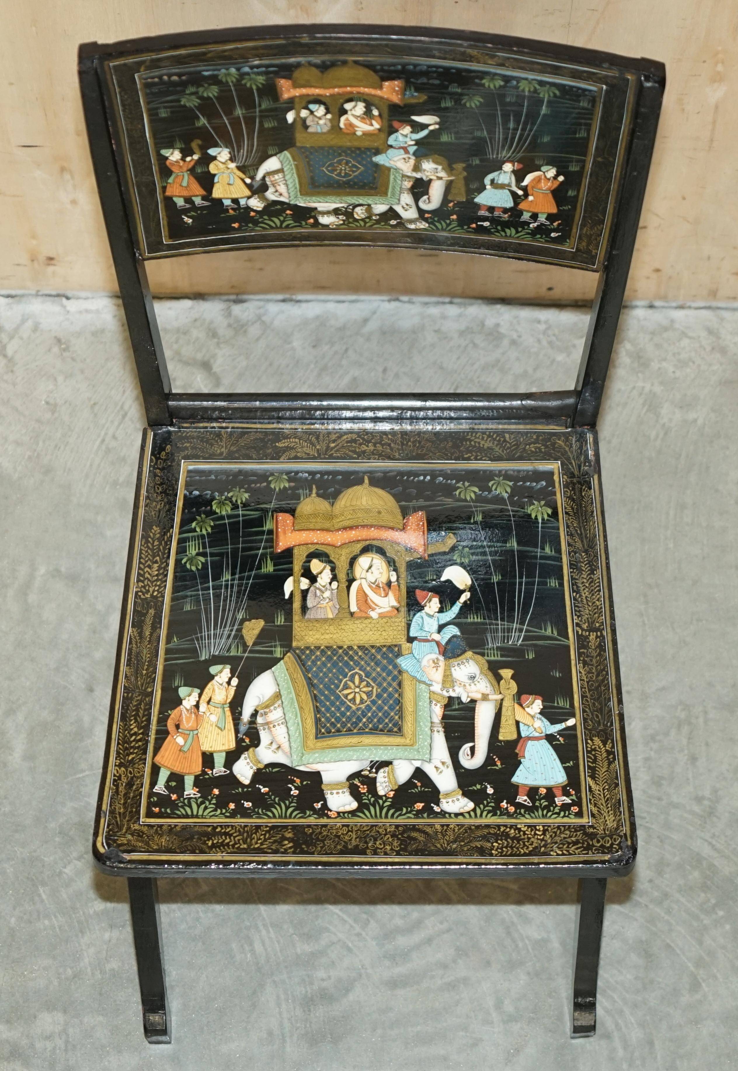 Pair of military folding chairs with Indian decoration.