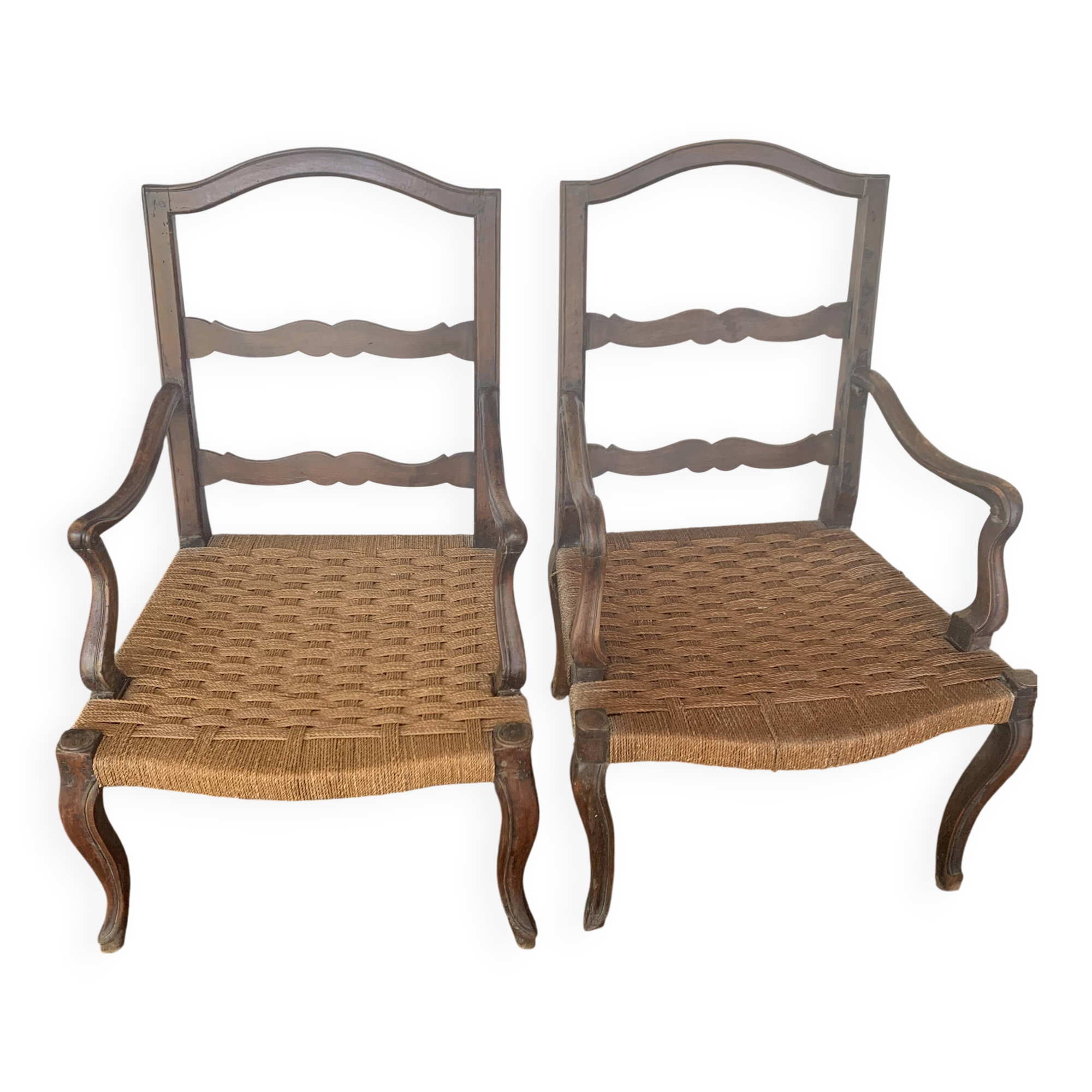 Pair of antique wooden armchairs with woven seats + cushions