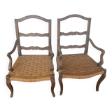 Pair of antique wooden armchairs with woven seats + cushions