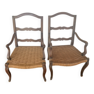 Pair of antique wooden armchairs with woven seats + cushions