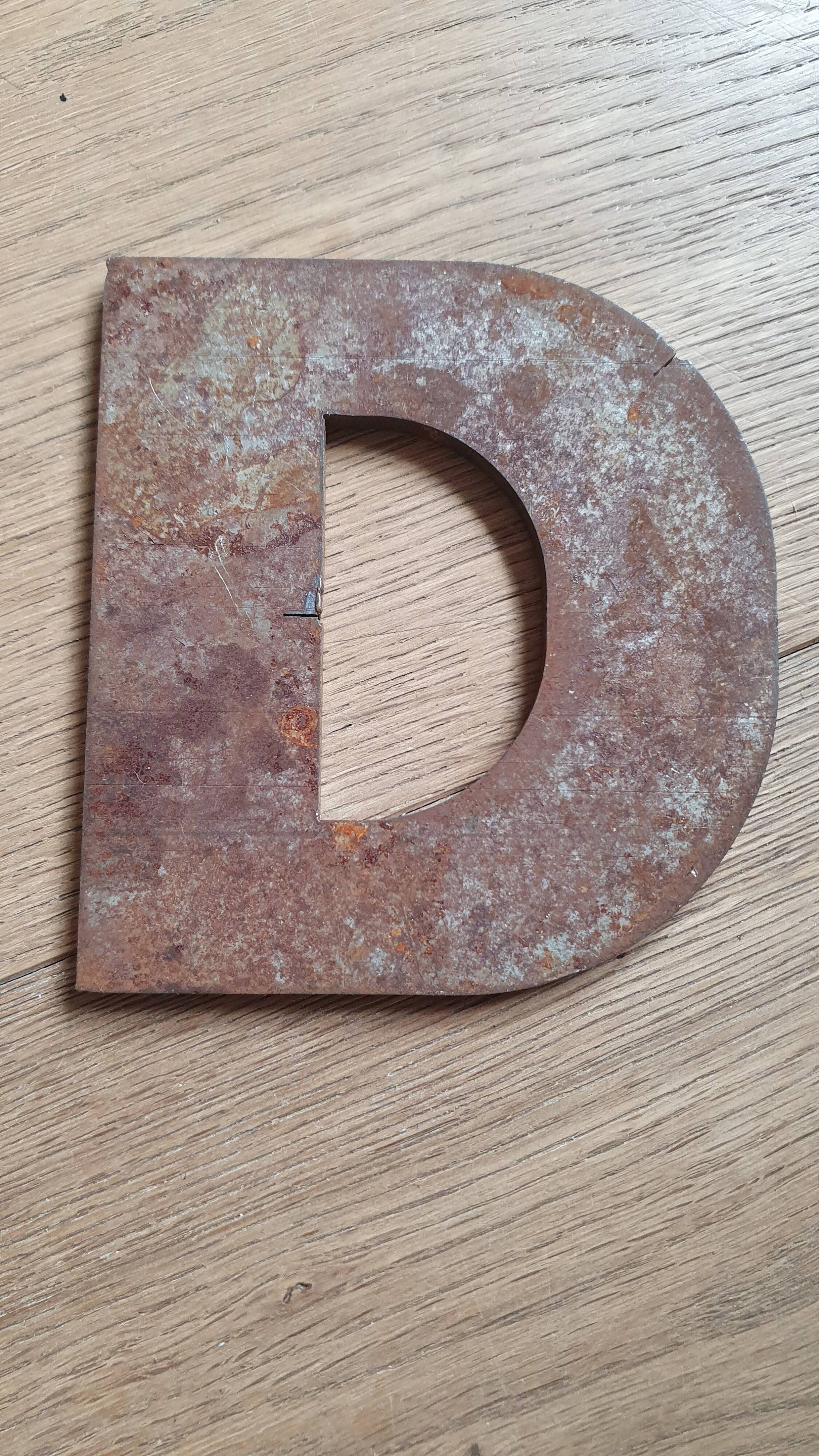 Metal letter D