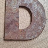 Metal letter D
