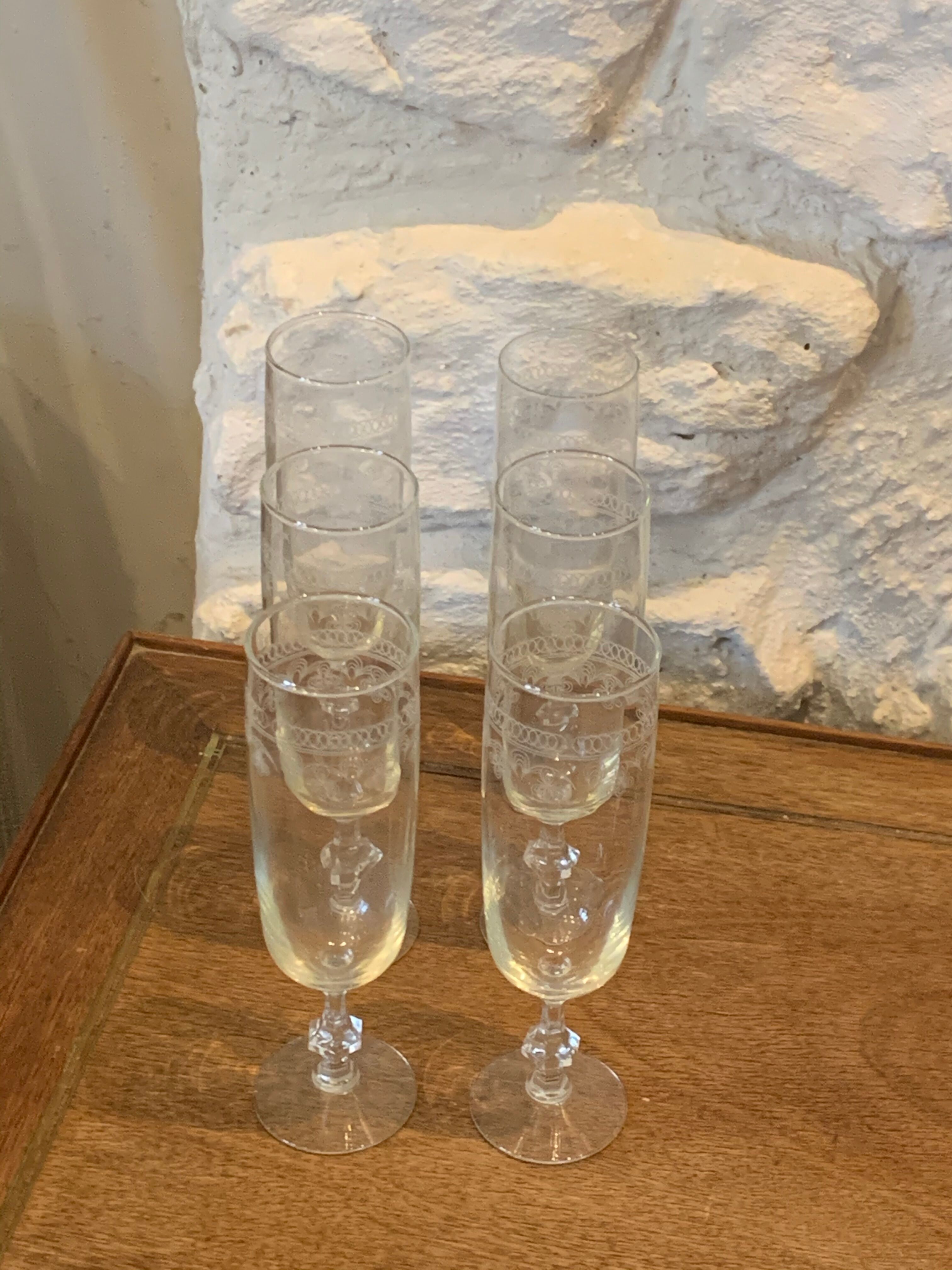 6 chiseled champagne flutes on vintage floral frieze pattern