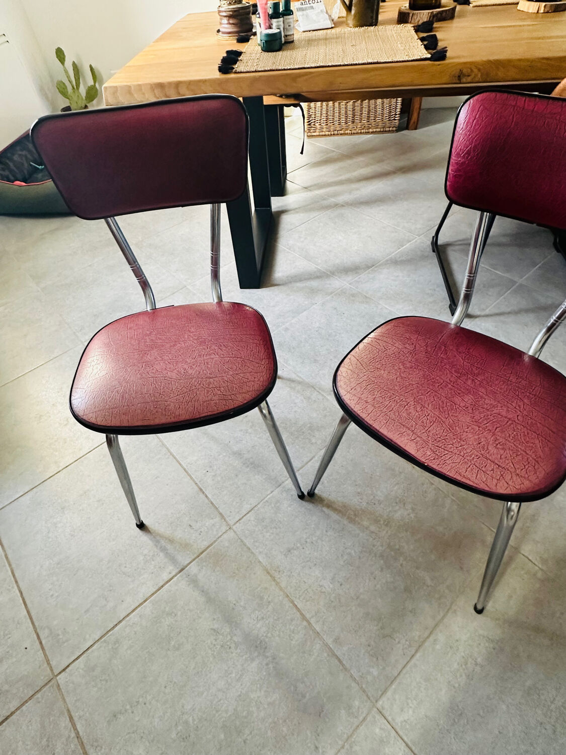 Pair of raspberry-colored chairs from the 60s/70s with metal legs